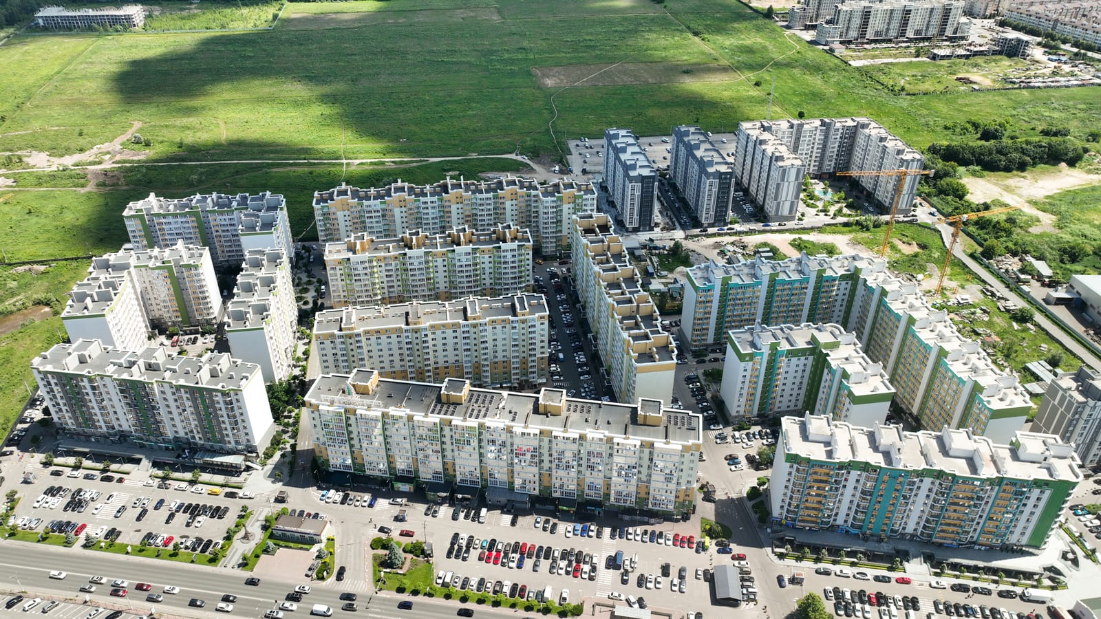 The Evromisto district by SAVO from the air with two tower cranes at work on the edge of the site
