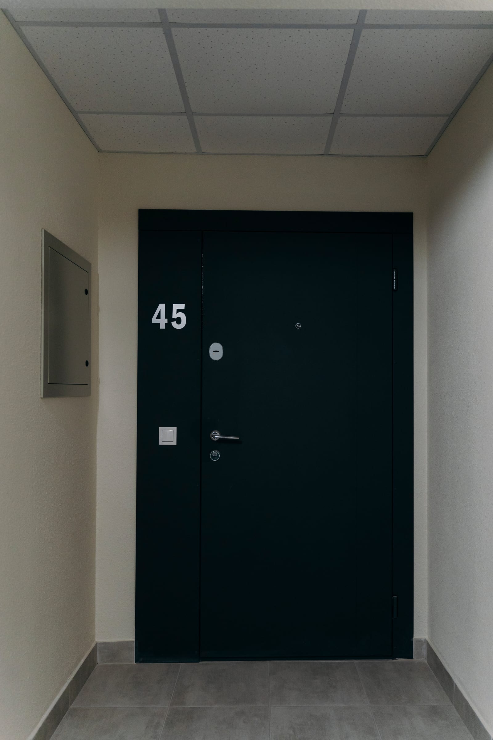 The front door of apartment 45 in a finished SAVO building, seen from the common corridor