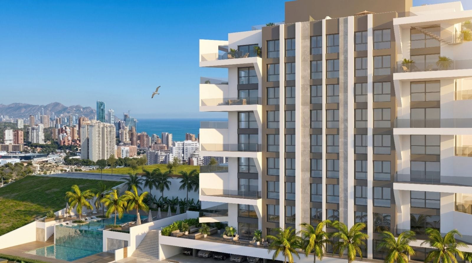 Villajoyosa Residence, project visualisation: the planned building above its pool terrace, with the Benidorm skyline and the sea behind it